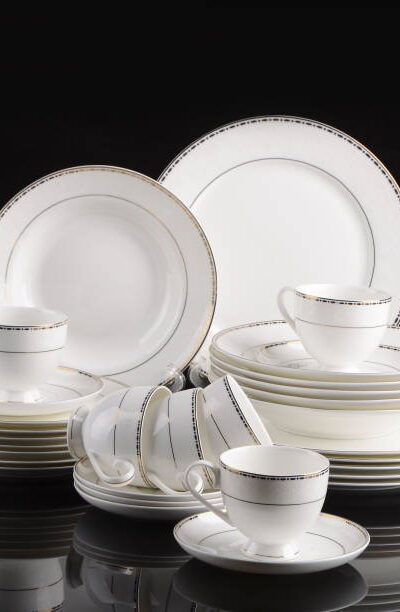 Porcelain dinner set isolated on black background clouse up
