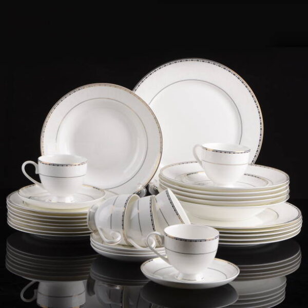 Porcelain dinner set isolated on black background clouse up