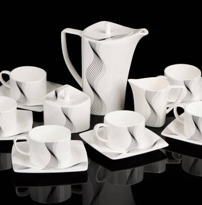 Tea set with cups, plates, pot, sugar bowl and milk jug
