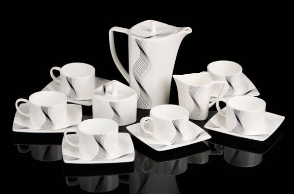 Tea set with cups, plates, pot, sugar bowl and milk jug