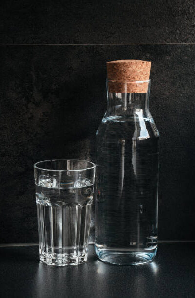 Glass, bottle, water, fresh concept. dark background. fresh concept.
