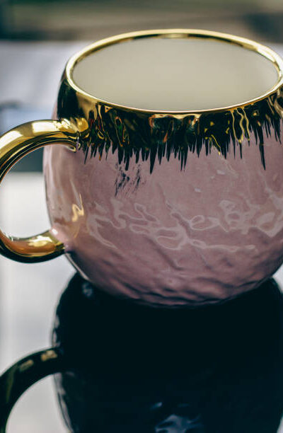 Pink teacup with gold details and gold handle